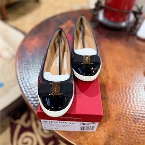 Salvatore Ferragamo Black and Gold Loafers